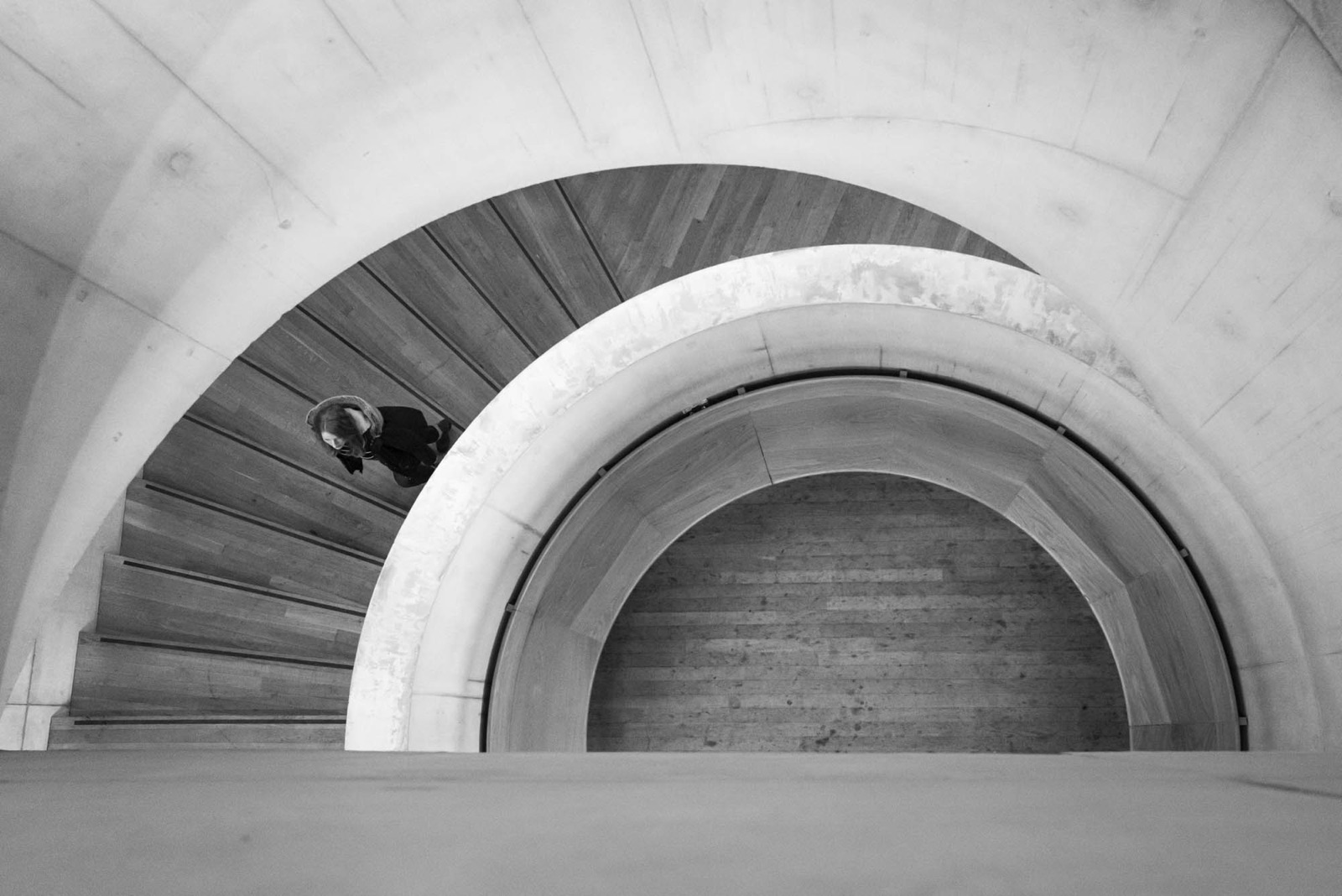 Black and white spiral staircase photographed from above